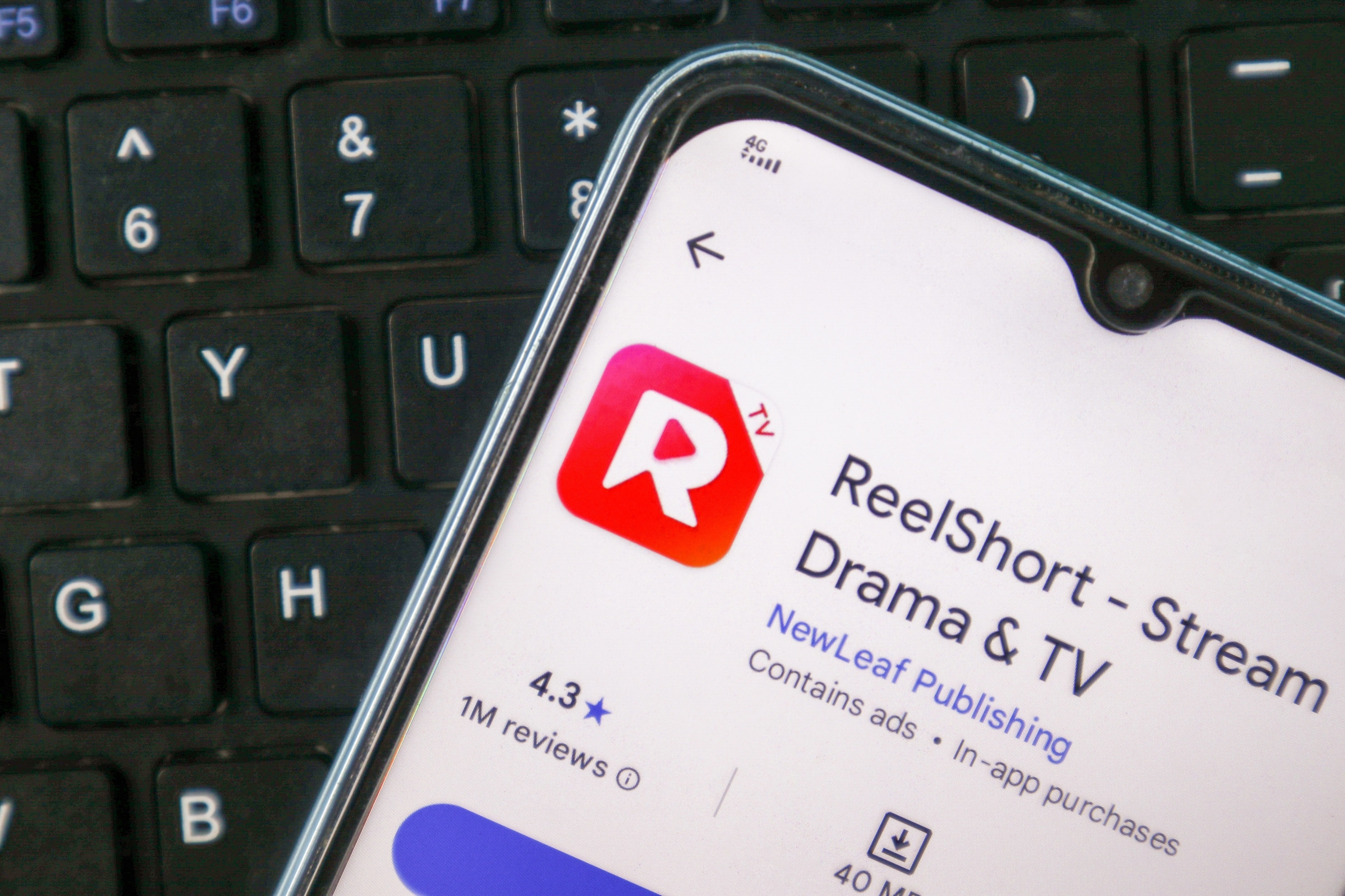 A mobile phone showing the downloadable ReelShort app | Source: Shutterstock