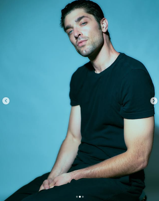 Griffin Blazi in a moody studio portrait, captured in soft blue light, as posted on July 15, 2025 | Source: Instagram/griffin.blazi