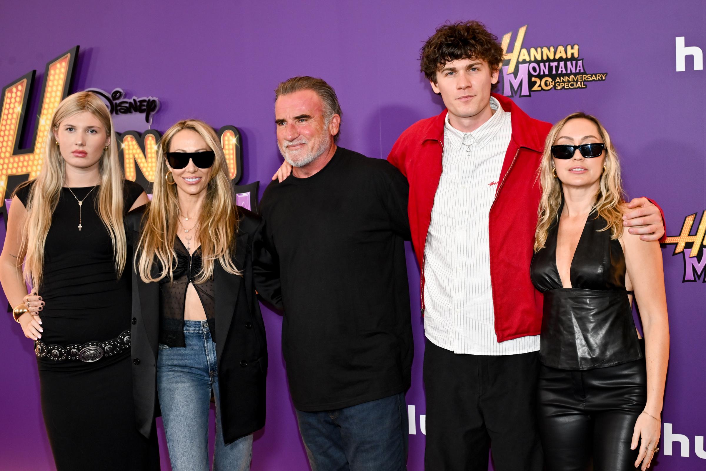 Joseph Purcell with, from L-R, Lily -Rose Purcell, Tish Cyrus, Dominic Purcell, and Brandi Cyrus at the world premiere of the "Hannah Montana 20th Anniversary Special" on March 23., 2026 | Source: Getty Images