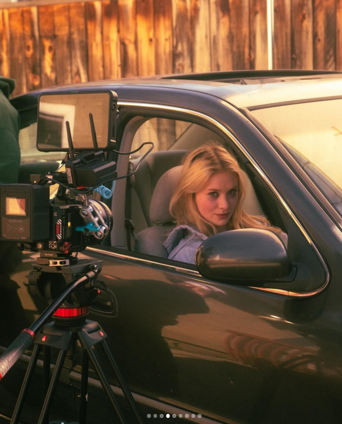 Kyra Wisely on set, captured behind the scenes during a car scene shoot, as posted on December 31, 2023| Source: Instagram/kyrawisely