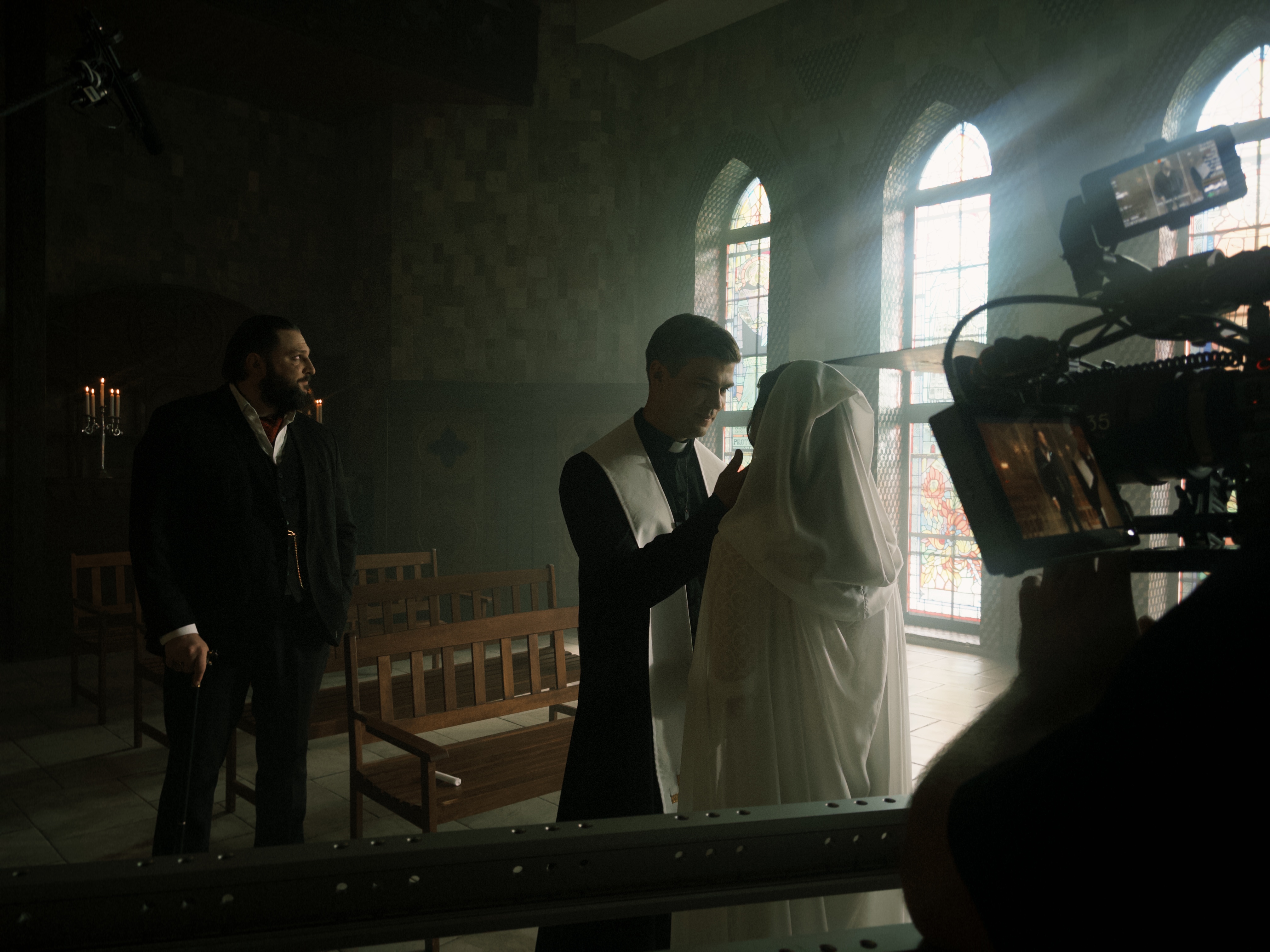 A quiet but emotional moment between Maksym Samchyk (Father Christopher Crow) and Oleksandra Pankova (Lisa Stone) near the end of the story. | Source: AMO Pictures