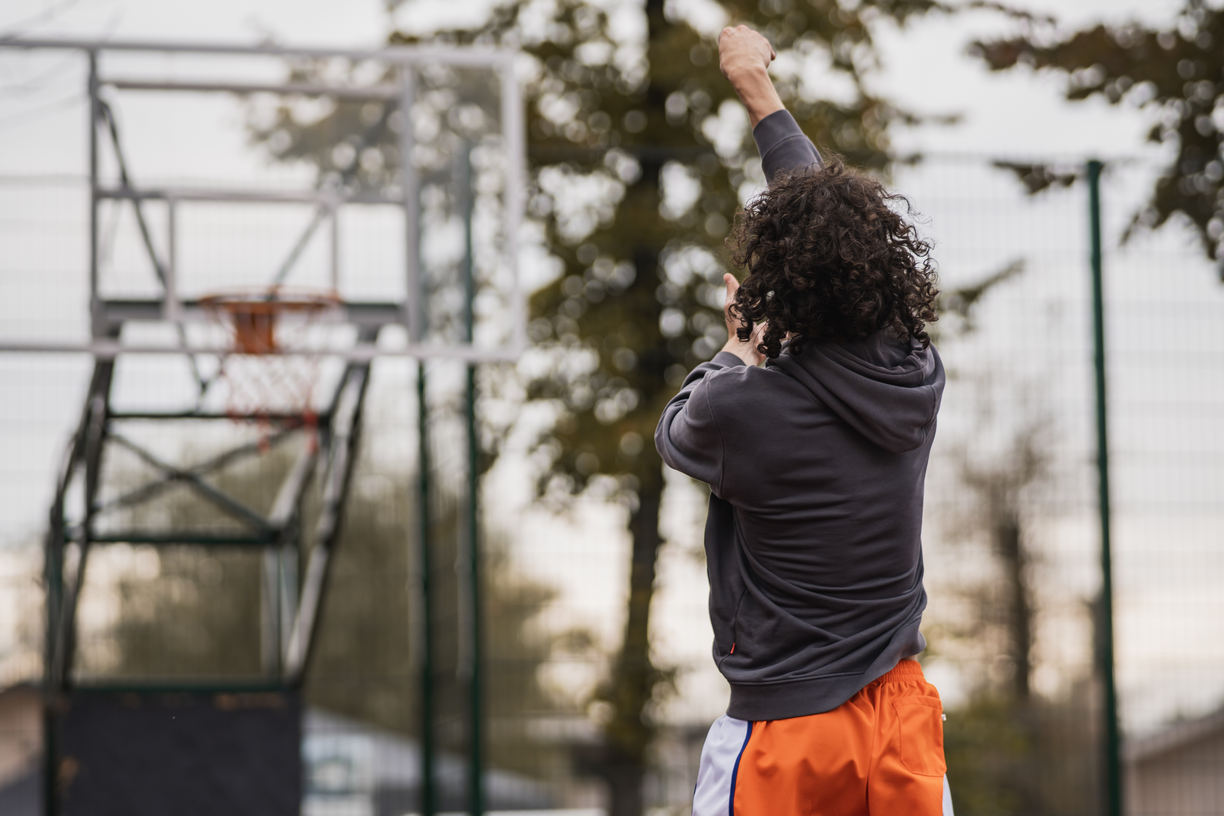 Dmytro Lyakh, who plays Shai, shooting hoops on the court | Source: AMO Pictures