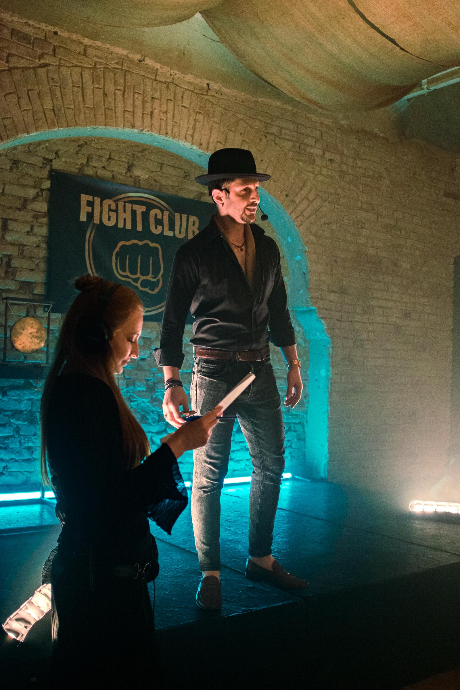 Actor Irakli Maruashvili appears as the announcer, setting the stage for the high-stakes fights. | Source: AMO Pictures