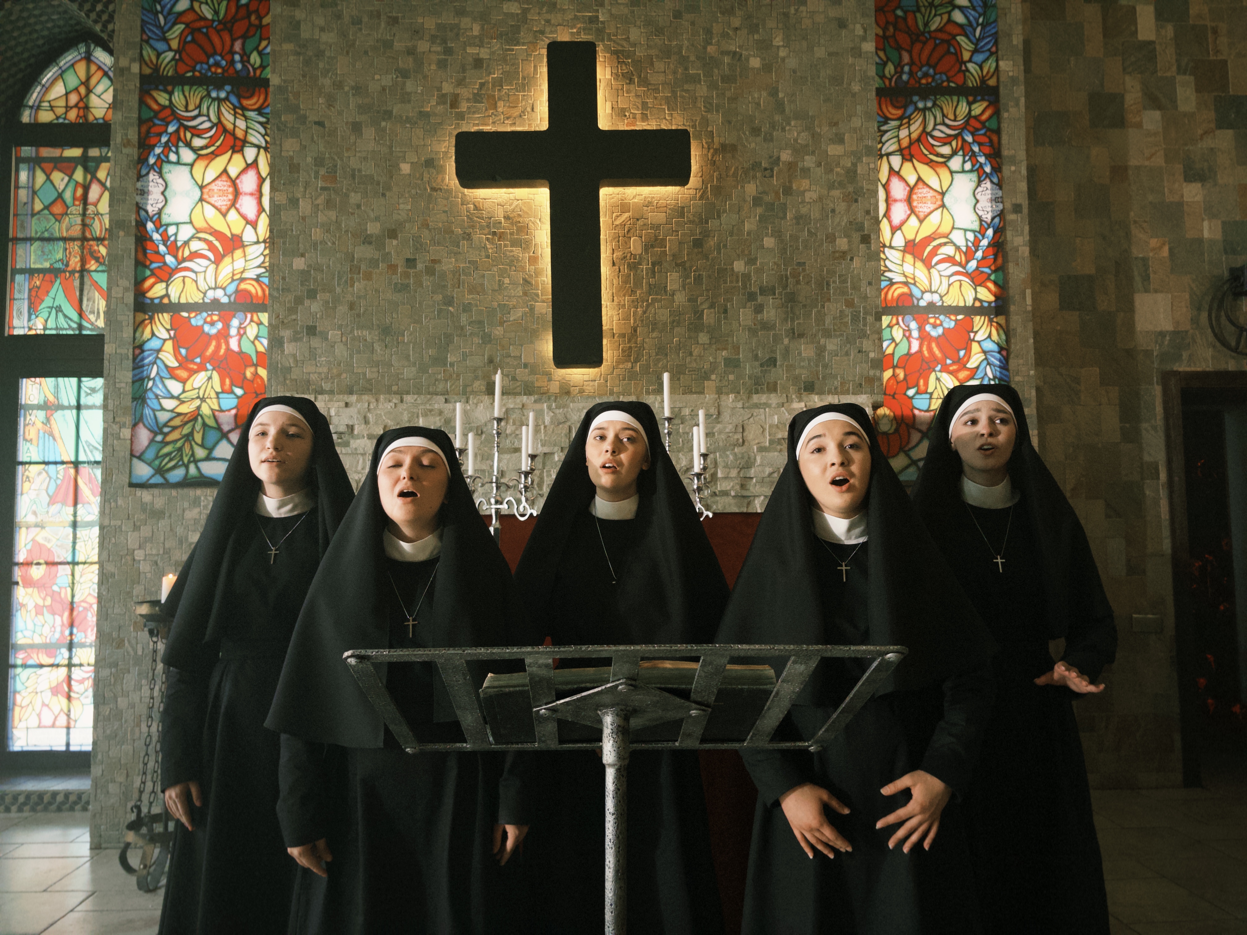 The choir plays a major role in shaping some of the series’ most powerful moments. | Source: AMO Pictures