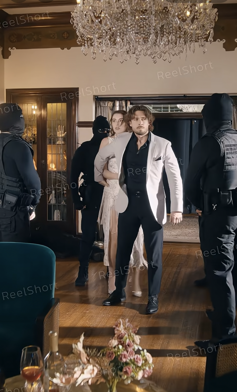 Cait Moira as Chloe Brooks and Ignacyo Matynia as Caspian Williams in "The Magnificent Bodyguard" | Source: youtube/reelshortapp