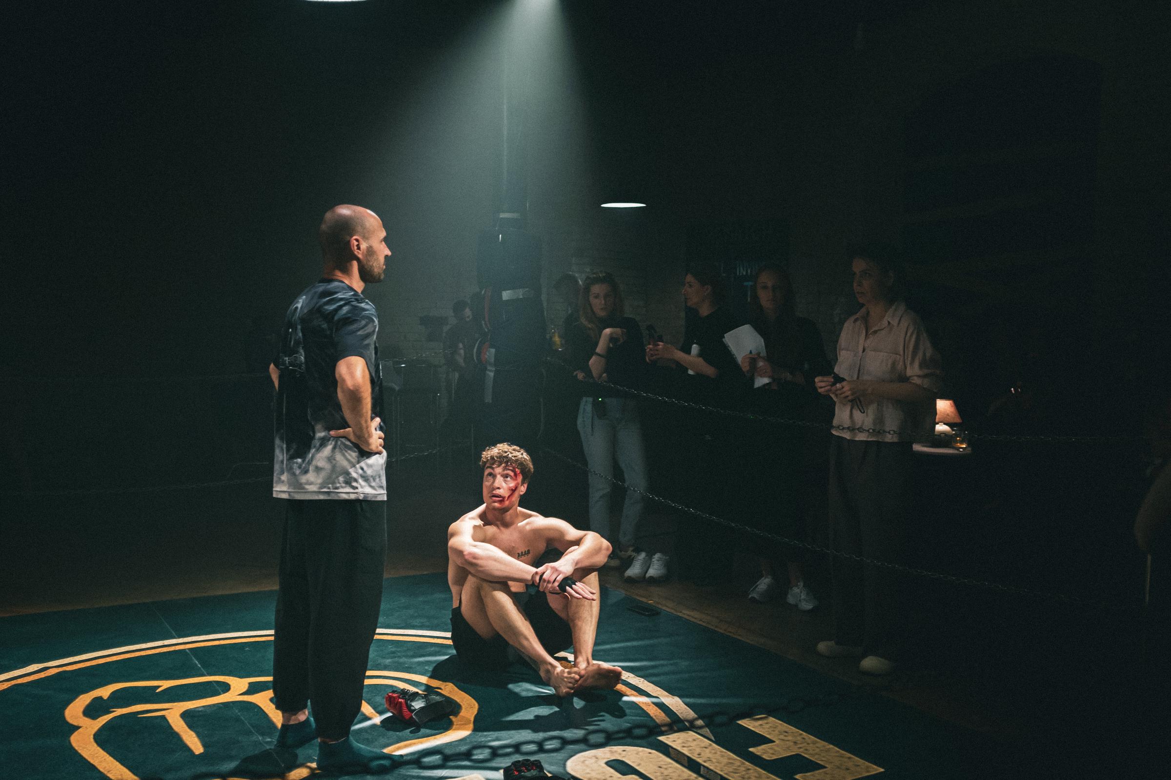 Director Yeva Strielnikova joins Nazar Grabar and the fight consultant to refine a key moment before filming. | Source: AMO Pictures