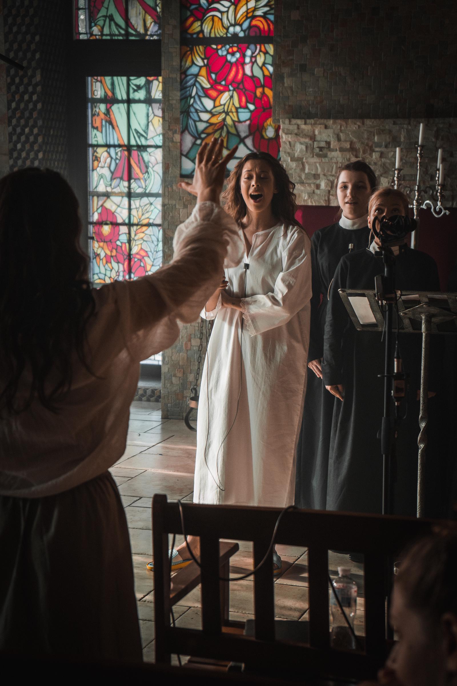 Pankova rehearses with the choir—scenes that required both vocal control and emotional intensity. | Source: AMO Pictures