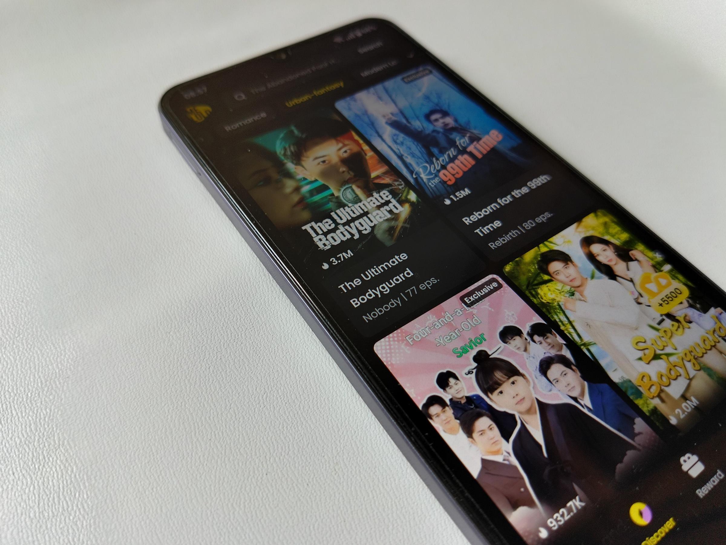 A mobile phone featuring a vertical drama app page | Source: Shutterstock