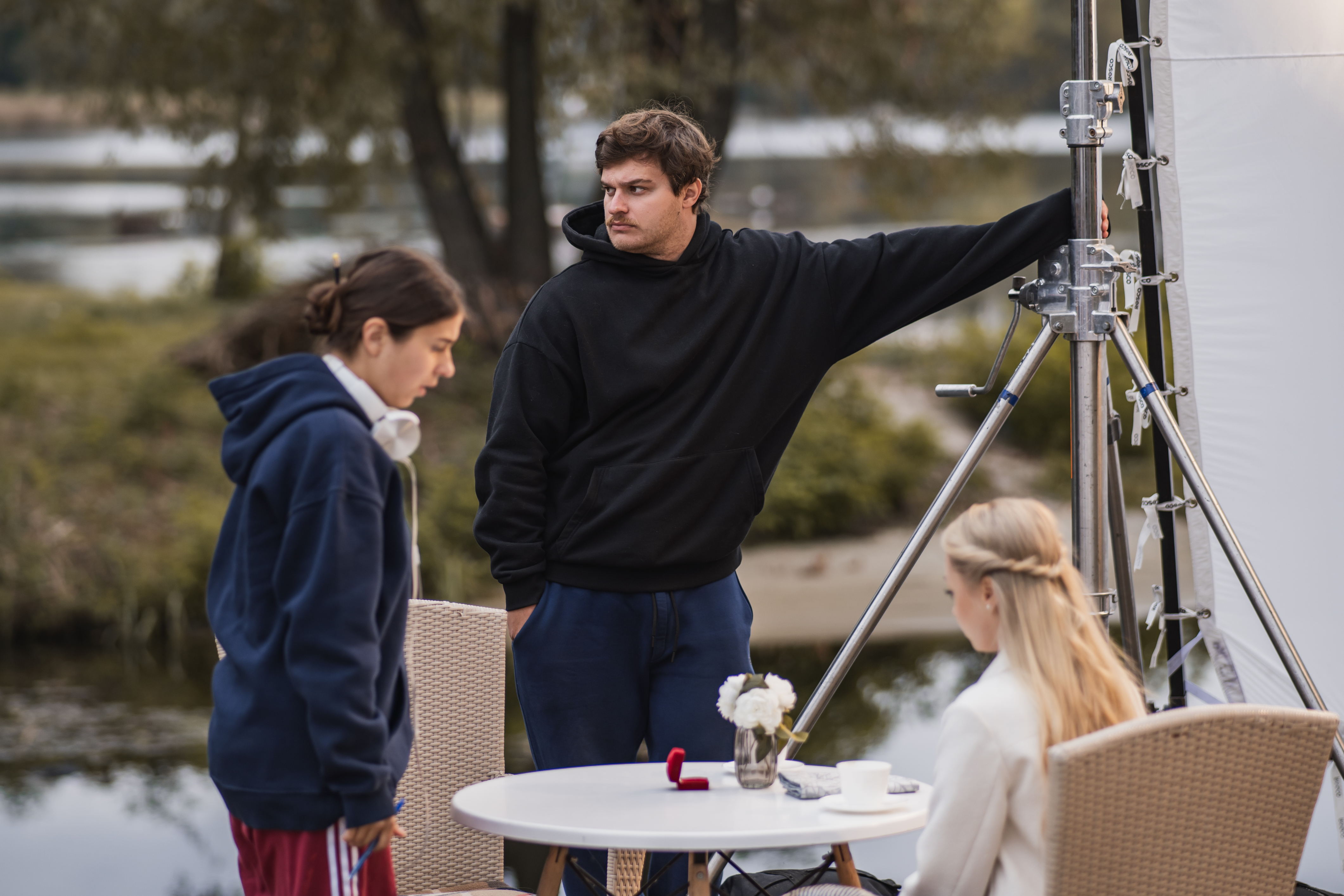 Director of Photography Bohdan Haidash, Director Kateryna Murakhovska, and actress Tetiana Baytalenko preparing for the proposal scene | Source: AMO PIctures