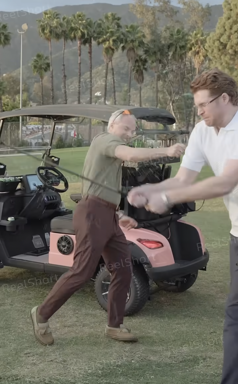A scene from "Corrupting My Billionaire Boss's Heart" where Brett (played by Bo Burroughs) and Royce (played by Rhett Wellington) have a heated encounter on the golf course | Source: youtube/reelshortapp