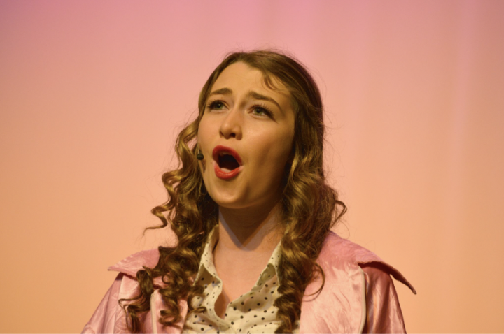 Vice performing as Marty in a high school production of "Grease" | Source: Madison Vice