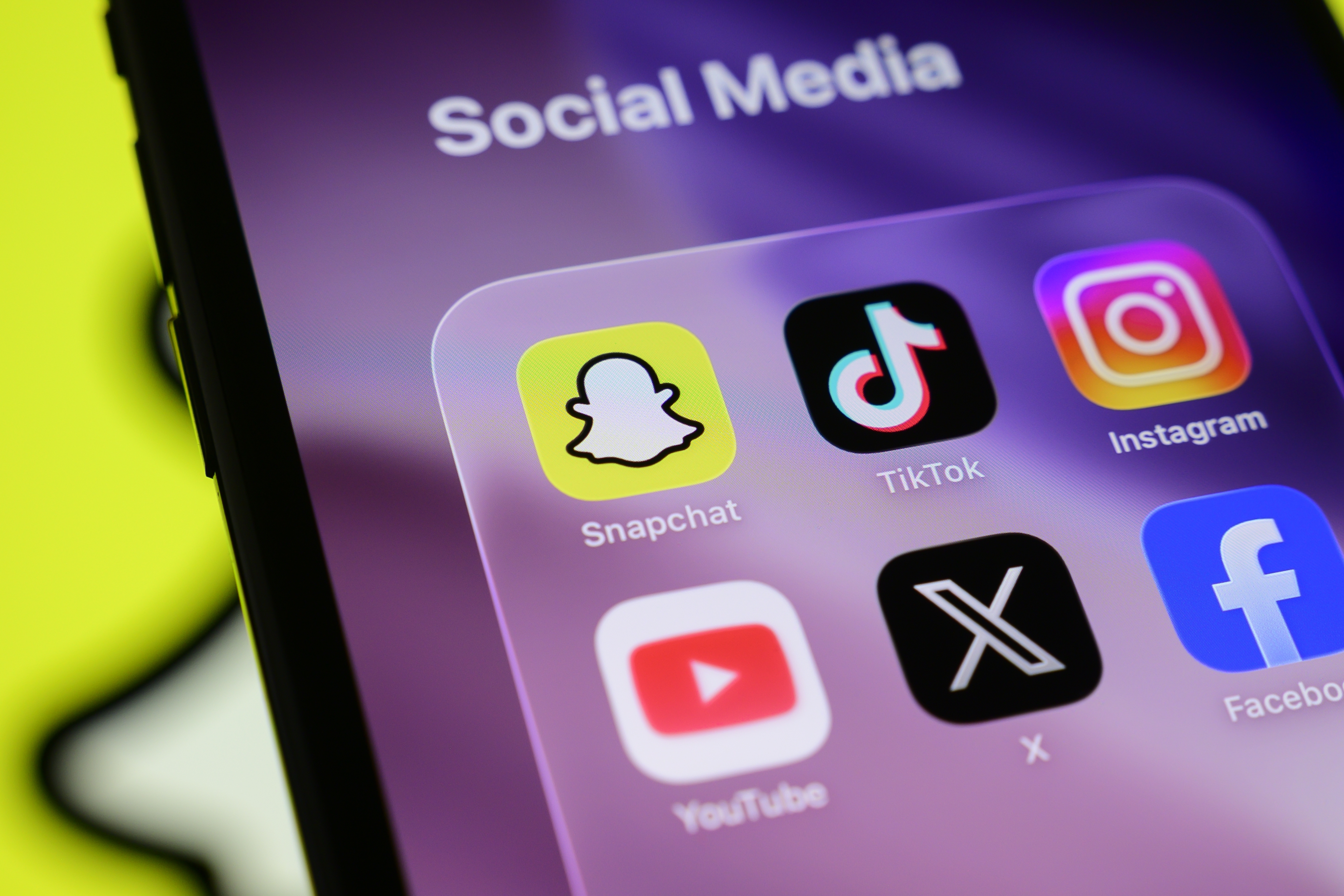 A mobile phone screen featuring social media icons | Source: Shutterstock