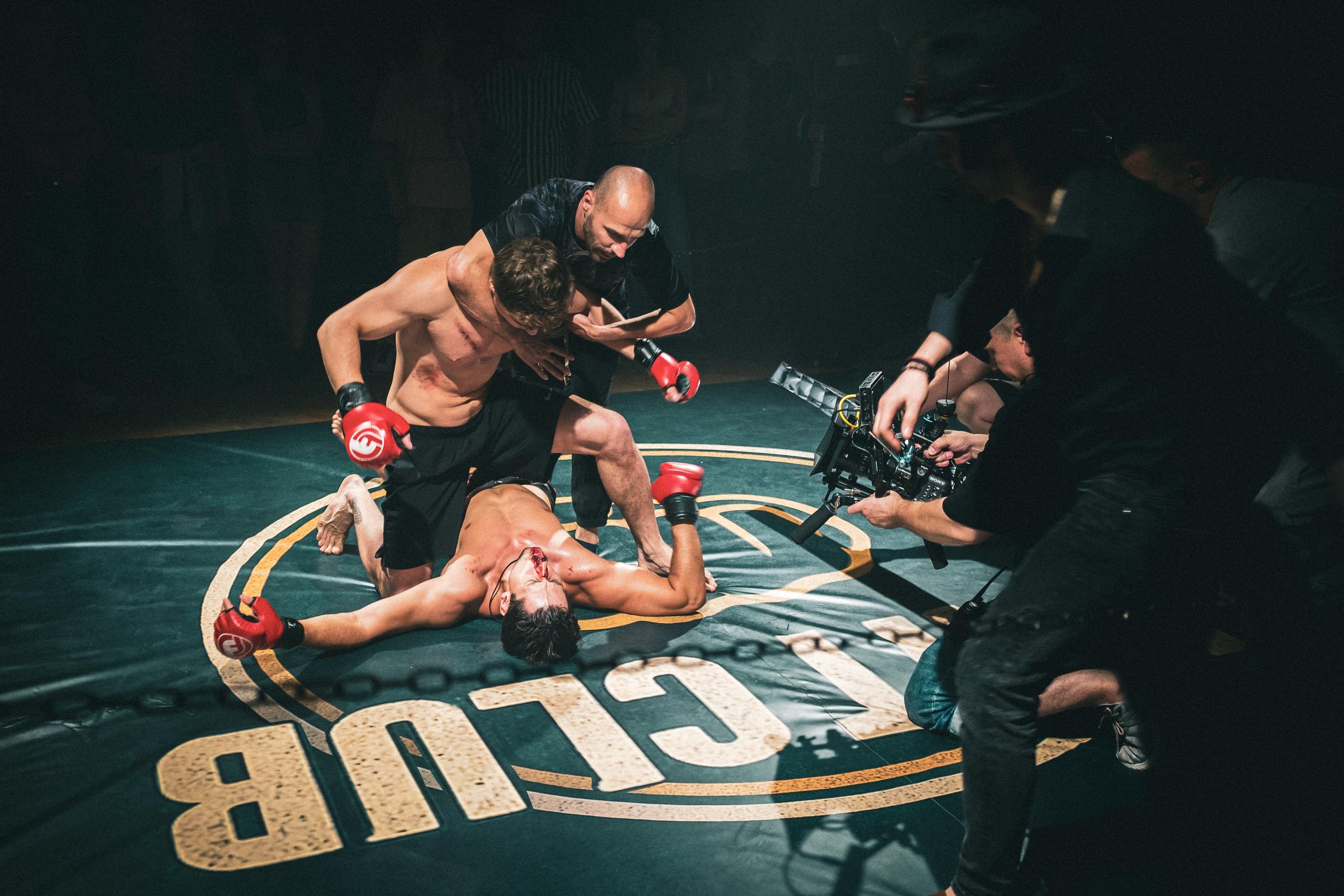 A fight scene consultant guides Nazar Grabar and Arthur Shurypa through choreography before filming. | Source: AMO Pictures